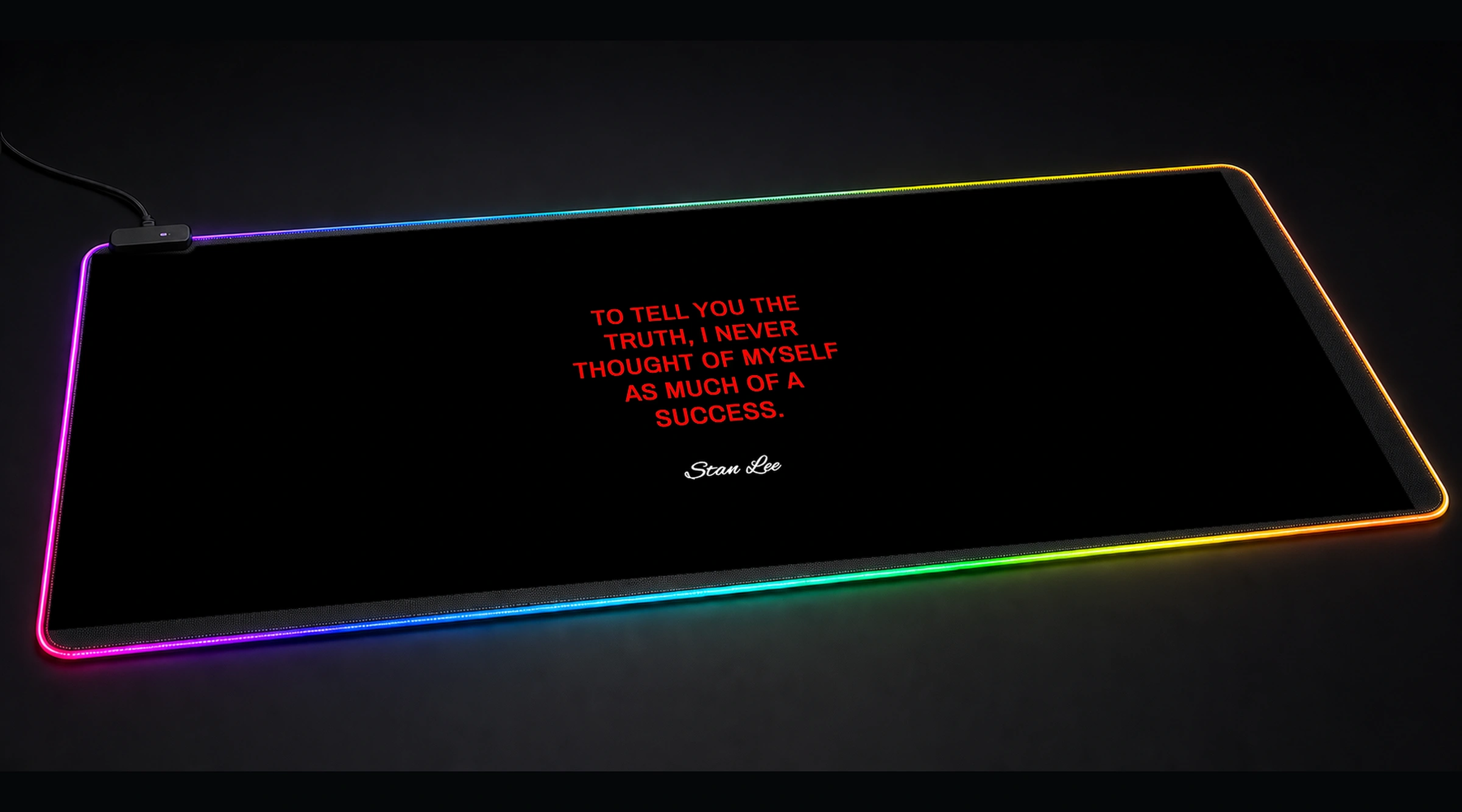 Stan Lee Quotes — Crimson Punchline motivational quote panoramic RGB gaming desk mat product view